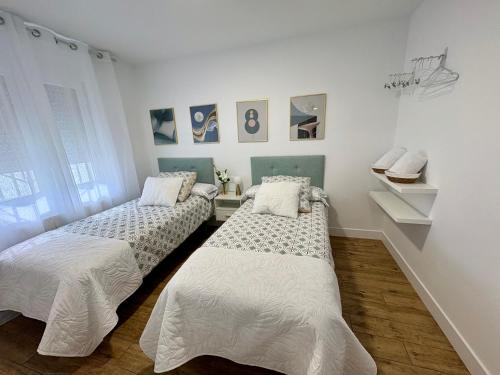 Postel nebo postele na pokoji v ubytování Gaude - Apartamentos Birdie