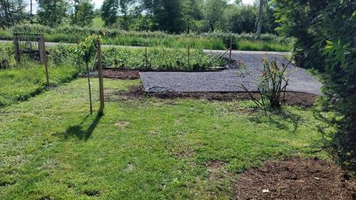 a garden with a garden plot with a vegetable garden at Fermette Ardennaise typique in Wanlin