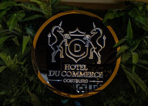 a sign for a hotel do commerce office at Hotel Du Commerce in Oostburg