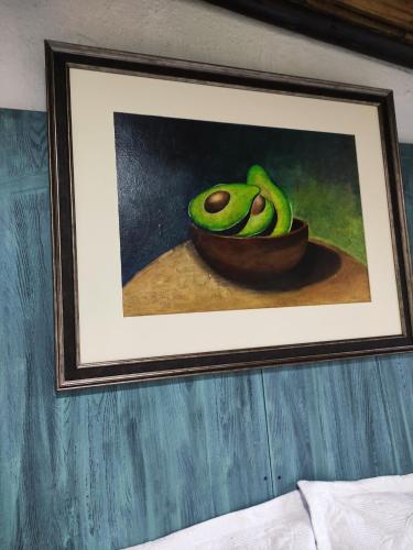 a picture of a painting of a bowl of avocado at Finca San Alejandro in Cotacachi