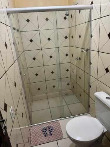 a bathroom with a shower with a toilet at Hotel Asa Branca in Boa Vista