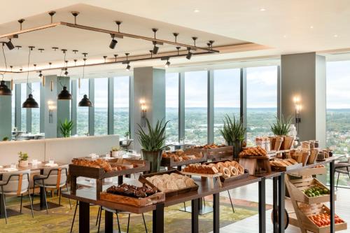 a bakery with a buffet of bread and pastries at Hilton Woking in Woking