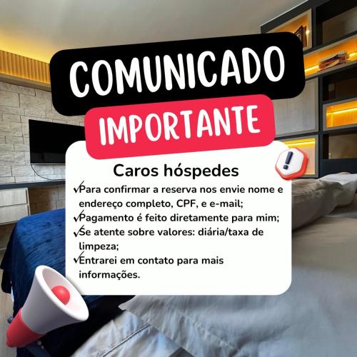 a sign for a bedroom with a bed in a room at Flat Pleasure in Goiânia