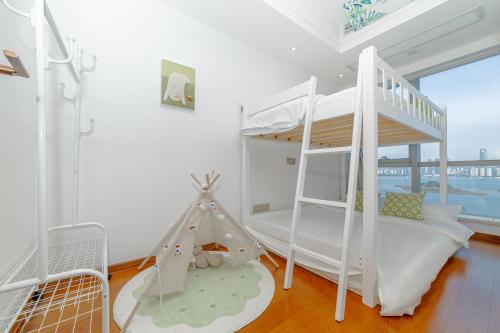 Postel nebo postele na pokoji v ubytování 厦门岚屿海景民宿