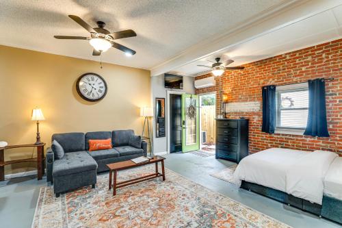 una camera da letto con un letto e un muro di mattoni di Backyard Oasis with Pool Sunny Sumter Studio! a Sumter