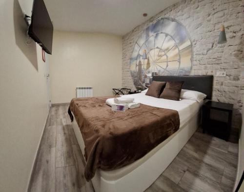 Ένα ή περισσότερα κρεβάτια σε δωμάτιο στο CH CRUZ MADRiD