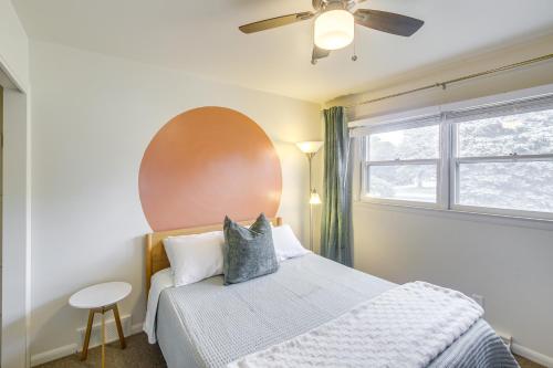 a bedroom with a large bed and a window at Updated Plymouth Home about 5 Mi to Road America! in Plymouth