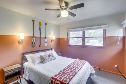 a bedroom with a bed and a ceiling fan at Updated Plymouth Home about 5 Mi to Road America! in Plymouth