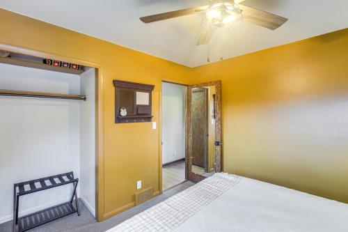 a bedroom with a bed and a ceiling fan at Updated Plymouth Home about 5 Mi to Road America! in Plymouth