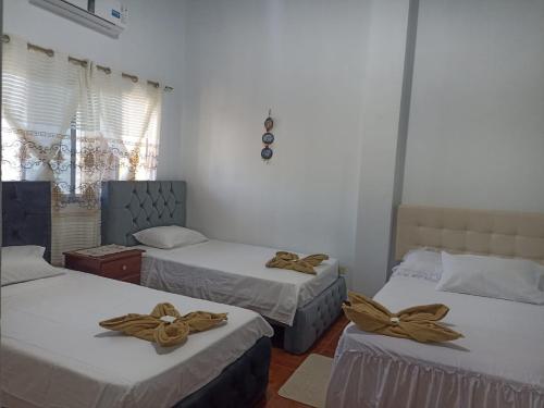 Postel nebo postele na pokoji v ubytování Hostal Dorys Mar