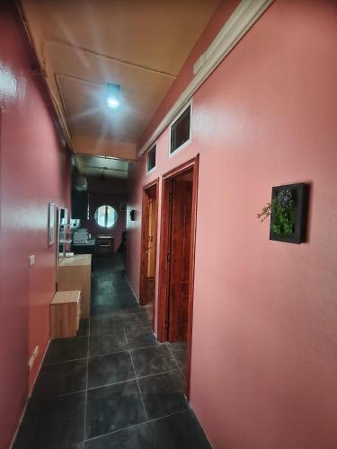 a hallway of a room with a red wall at Bonanza Patong Beach2 for 2 BR 100m to Beach Grace Room in Patong Beach