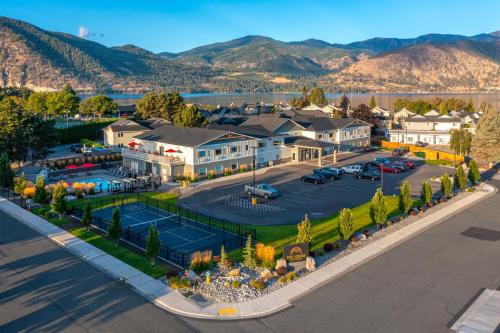 an aerial view of a resort with a tennis court at The Lodge Lake Chelan in Manson