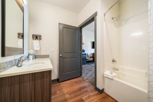 a bathroom with a sink and a mirror at The Lodge Lake Chelan in Manson