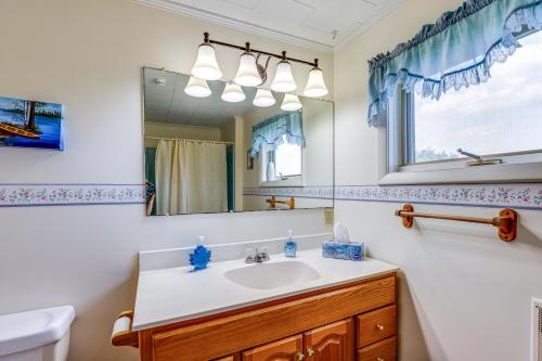 a bathroom with a sink and a mirror at Penn Yan Vacation Rental Near Seneca and Keuka Lakes in Penn Yan