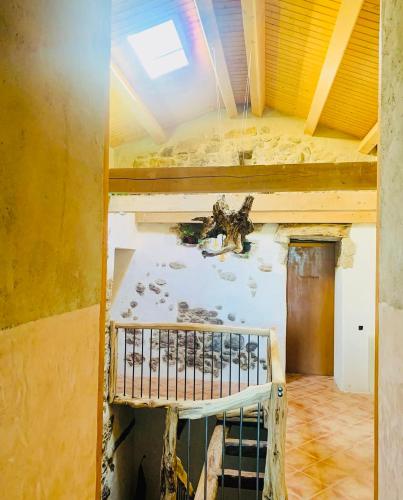 an empty room with a ceiling in a building at Angrill in Lladurs