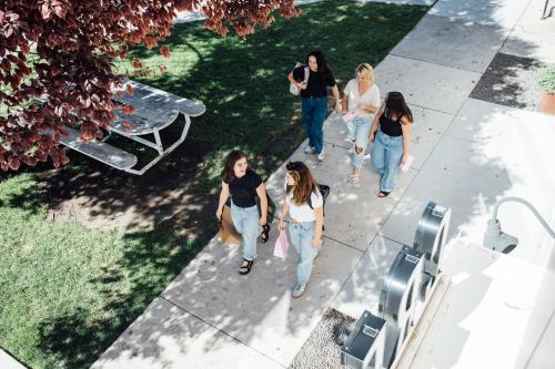 a group of girls walking down a sidewalk at Maven STAY in Salt Lake City