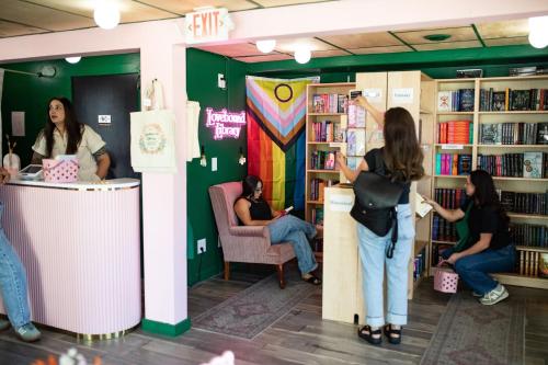 a group of people standing in a library at Maven STAY in Salt Lake City