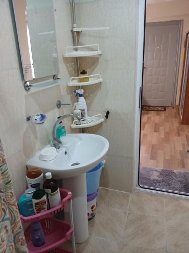 a bathroom with a sink and a mirror at уют in Rustavi