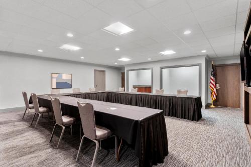 a conference room with a long table and chairs at Holiday Inn Dubuque/Galena by IHG in Dubuque