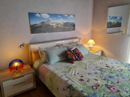 A bed or beds in a room at Rifugio Nel Bosco
