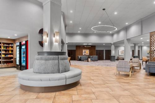 a lobby with a fountain in the middle of a room at Holiday Inn Dubuque/Galena by IHG in Dubuque