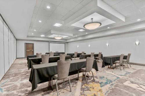 a conference room with a table and chairs in it at Holiday Inn Dubuque/Galena by IHG in Dubuque