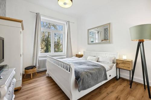 Ένα ή περισσότερα κρεβάτια σε δωμάτιο στο Kaiser-Wilhelm-Lodge Apartment mit 90m2