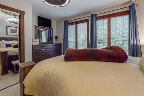 a bedroom with a large bed and a mirror at Big Boulder Bliss in Lake Harmony