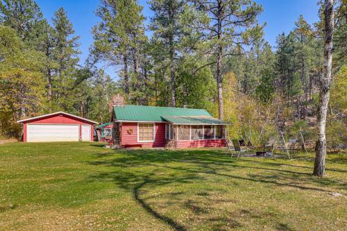 a cabin in the woods with a large yard at Historic Keystone Cabin Near Mount Rushmore! in Keystone