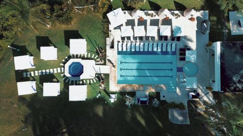 an overhead view of a building with a swimming pool at Dharma Hotel Boutique Spa in San Jerónimo