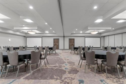 a conference room with a table and chairs in it at Holiday Inn Dubuque/Galena by IHG in Dubuque
