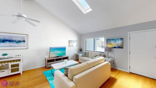 a living room with a couch and a table at Beach Rd, 300ft to Beach Access & 500ft to Siesta Key Village, 2bdr & Studio in Siesta Key