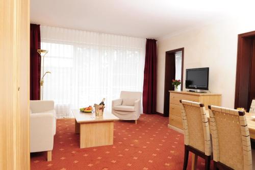 TV a/nebo společenská místnost v ubytování Hotel Villa Gropius