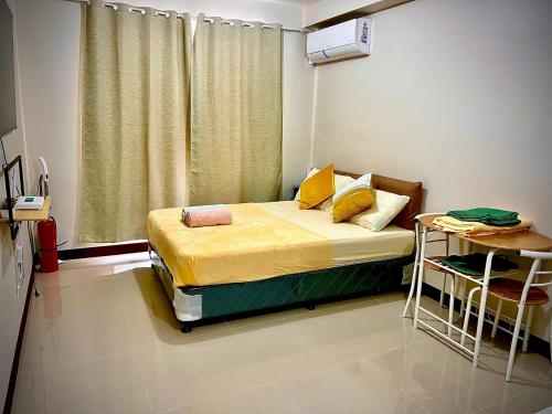 Llit o llits en una habitació de Saekyung Condo