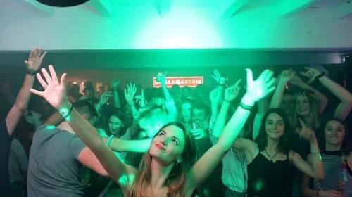 a crowd of people raising their hands in a club at Les chambres de Lily in Carresse