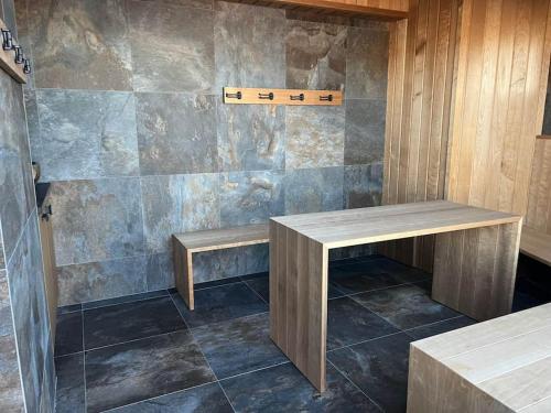 a room with two wooden benches and a wall at Kopparvillan 37B - Åre Valley Lodges in Åre
