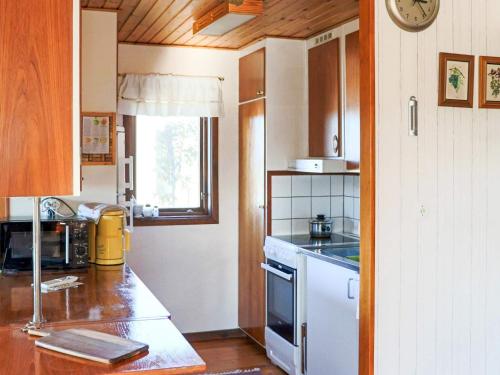a kitchen with a counter and a stove top oven at 6 person holiday home in Laholm-By Traum in Laholm