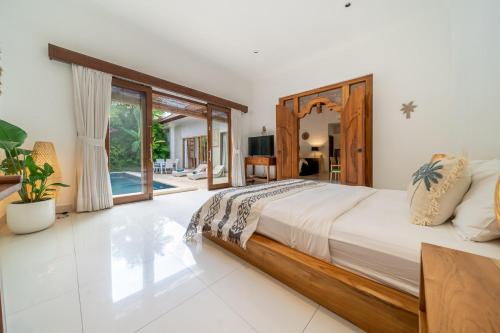 Postel nebo postele na pokoji v ubytování Villa Nemia Seminyak