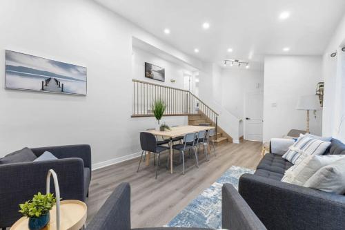 a living room with a couch and a table at Spacious Urban Cabin in West Montreal - 4BR in Montréal