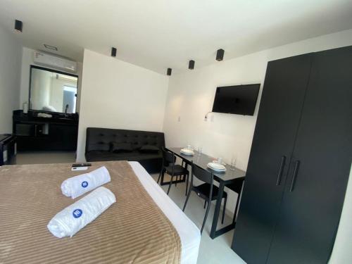 Televisyen dan/atau pusat hiburan di Pipa Premium Flat - com piscina privativa e estacionamento