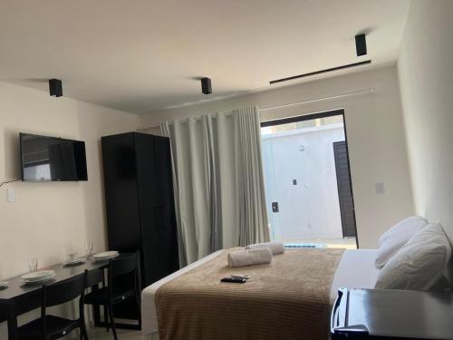 Televisyen dan/atau pusat hiburan di Pipa Premium Flat - com piscina privativa e estacionamento