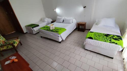Postel nebo postele na pokoji v ubytování Hotel Hotu Matua by EI
