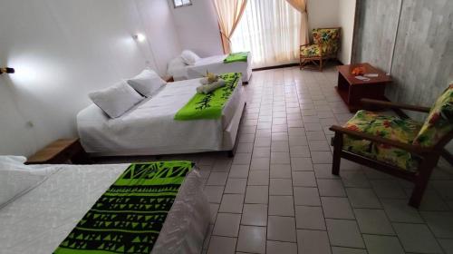 Postel nebo postele na pokoji v ubytování Hotel Hotu Matua by EI