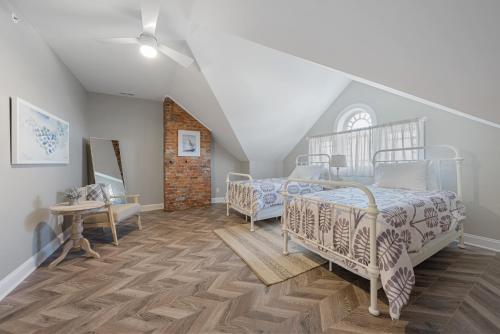 a bedroom with two beds in a attic at The Washington Downtown Boutique Hotel in Sandusky