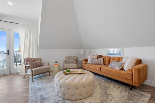a living room with a couch and a table at The Washington Downtown Boutique Hotel in Sandusky