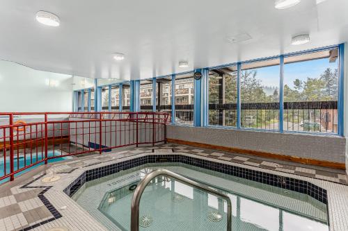 a swimming pool on the balcony of a building at Tonquin Inn in Jasper
