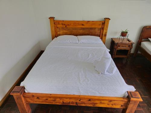 Una cama o camas en una habitación de Haven Hotel