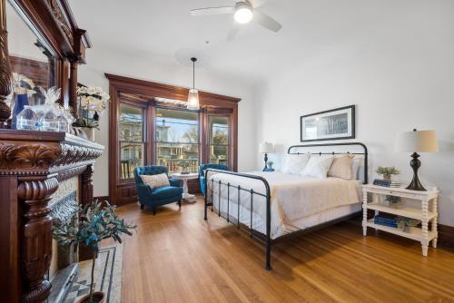 a bedroom with a bed and a table and chairs at The Washington Downtown Boutique Hotel in Sandusky
