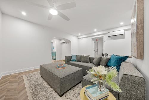 a living room with a couch and a table at The Washington Downtown Boutique Hotel in Sandusky