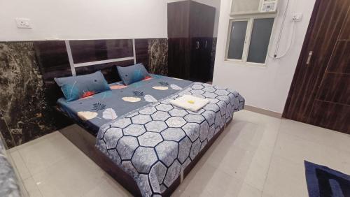 a bedroom with a bed in a room at Spiritual Apartment in Vrindāvan